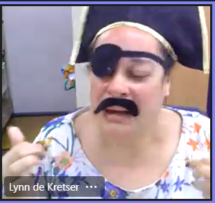 Lynn on a Teams called dressed like a pirate with a fake moustache, eye patch and pirates hat. Click to view full image.